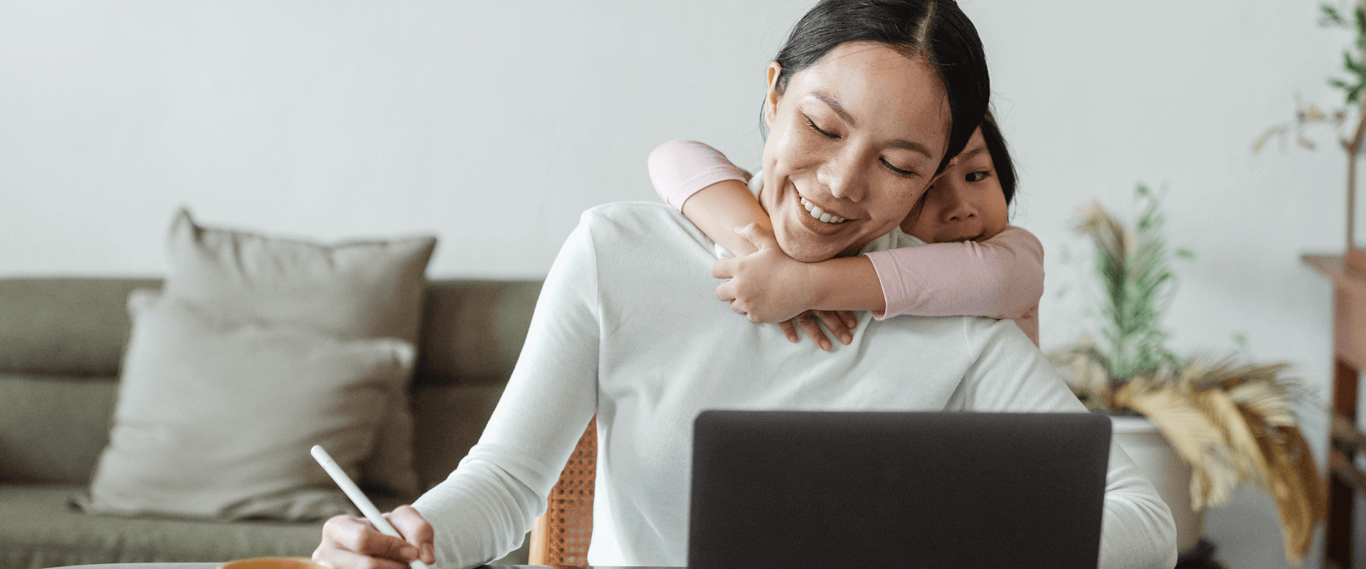 Remote Worker at Home Desk With Child